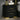 Black nightstand with gold accents and 2 drawers