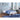 Bedroom with a white bed frame, blue bedding, and cityscape view.