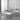 Set of marble coffee table and side tables with metal frames in a modern interior setting.