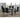 Glass dining table set with six black chairs
