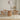 Dining area with wooden table and chairs in a minimalistic room.