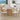 Dining area with wooden table and chairs in a modern kitchen.